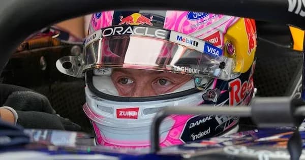 Driver focused in cockpit of racing car