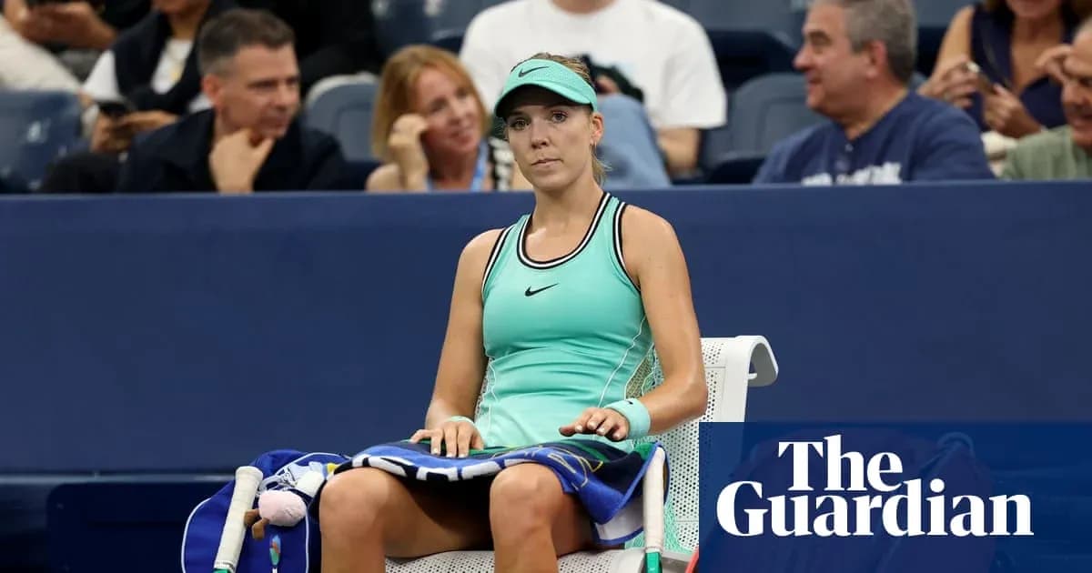 Tennis player sitting on bench during match