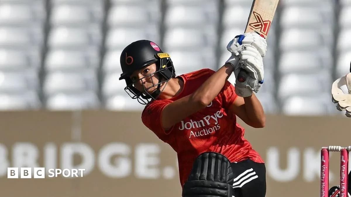 Batter playing a shot during cricket match