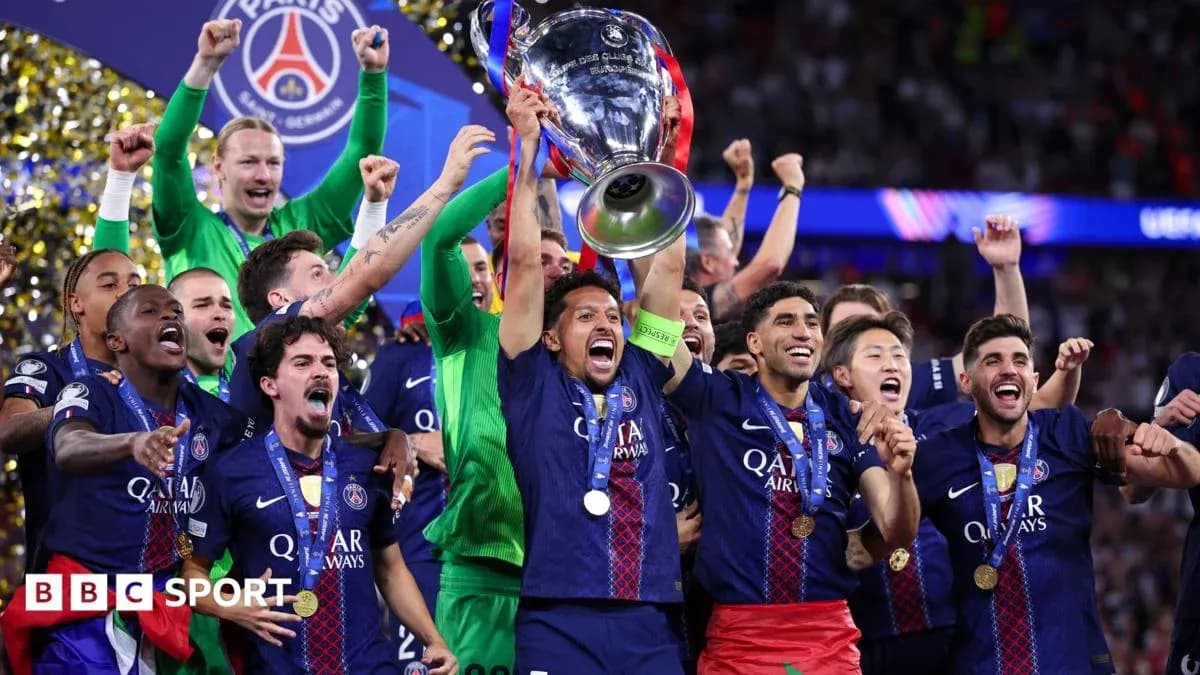 PSG players celebrating with UEFA Champions League trophy