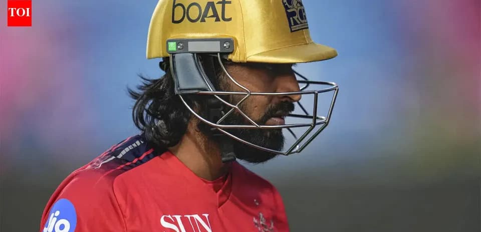 Cricketer wearing a helmet during match preparation