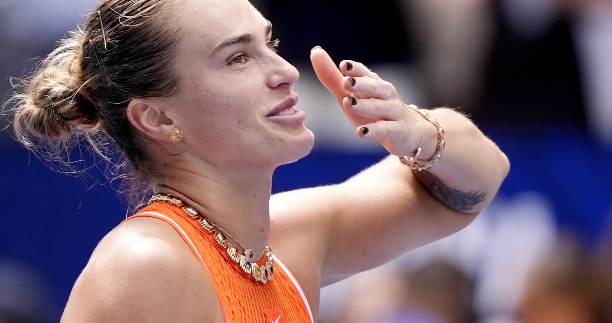 Tennis player celebrating after winning a match