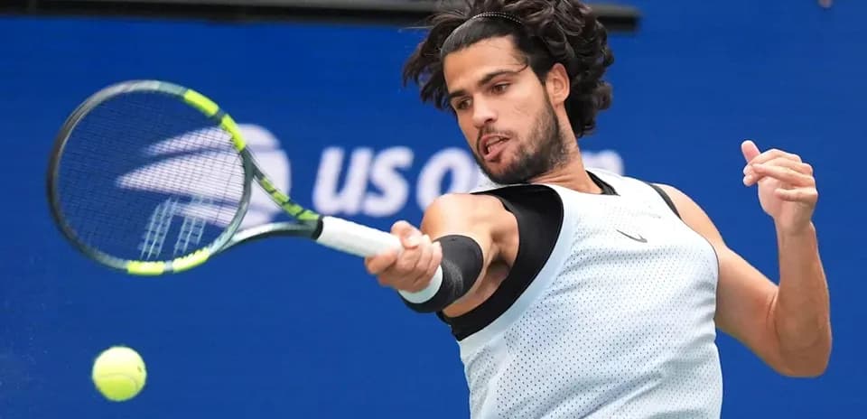 Player hitting a forehand during tennis match