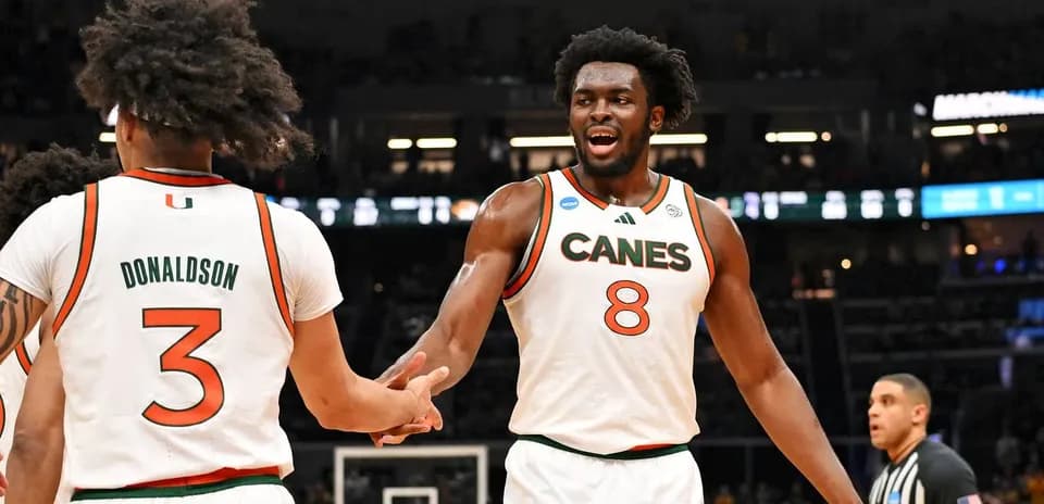 Two Miami players celebrating during a game