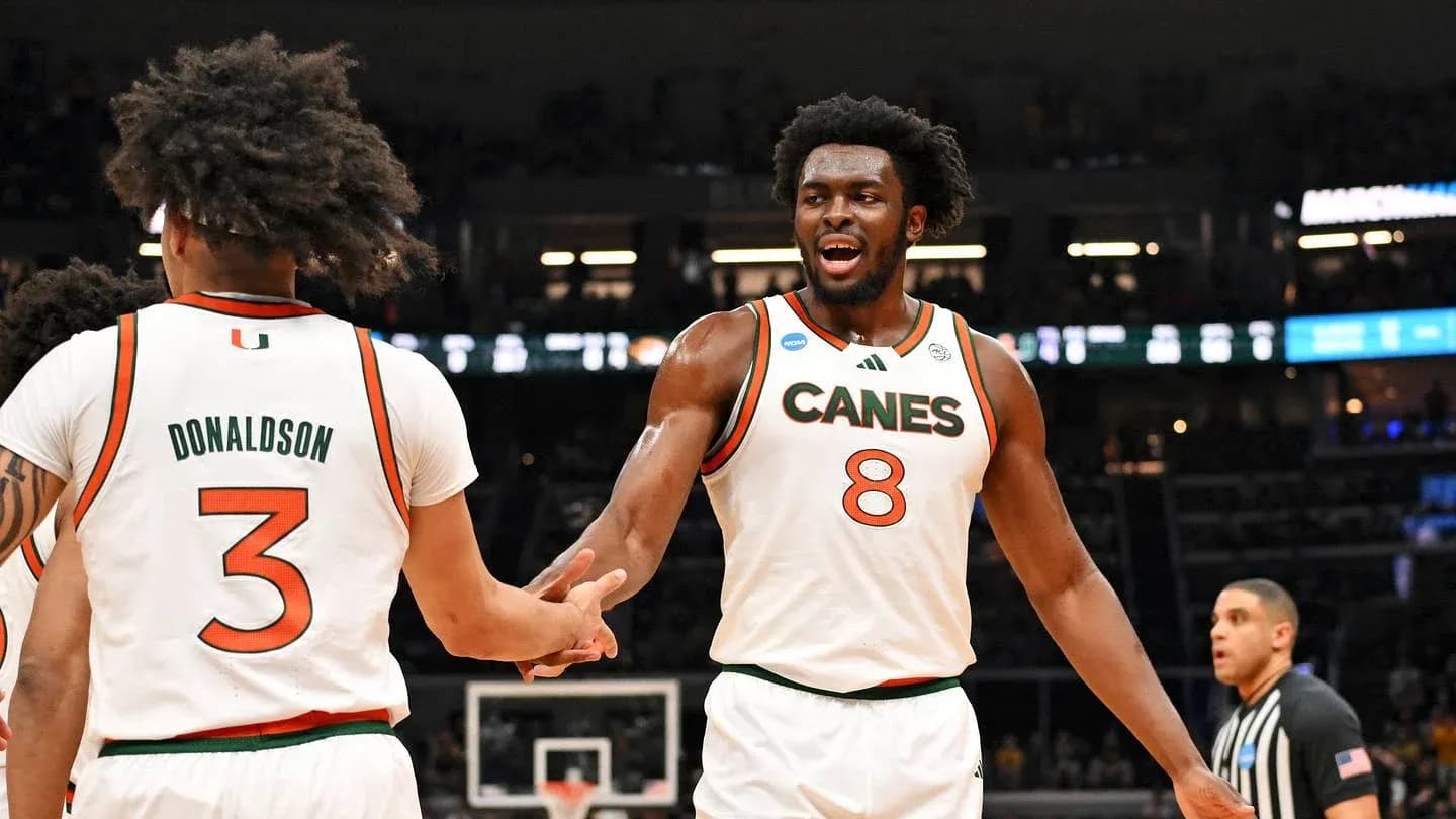 Two Miami players celebrating during a game