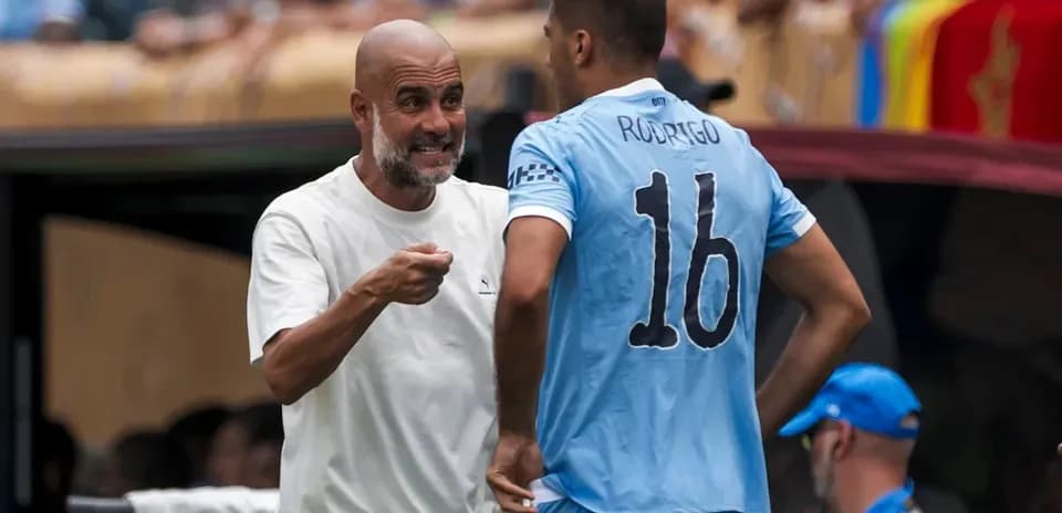 Manager discussing strategy with player on sidelines
