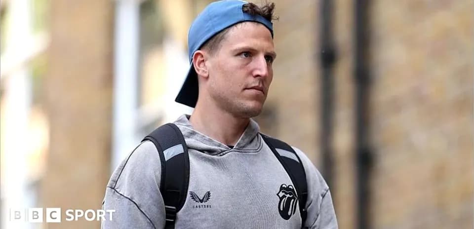 Athlete walking with a backpack in casual attire