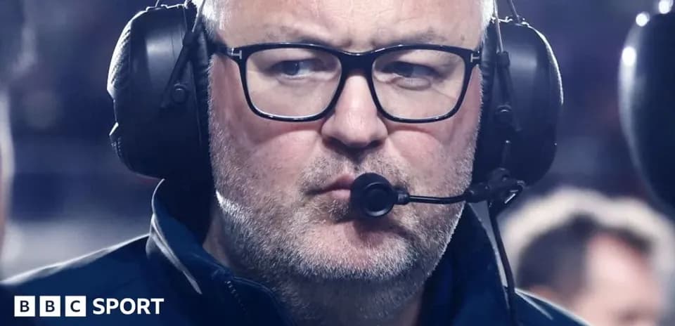 Coach wearing headset during a match
