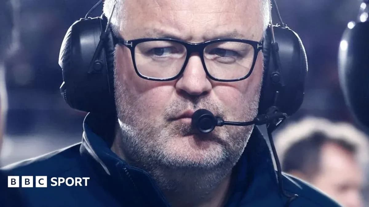Coach wearing headset during a match