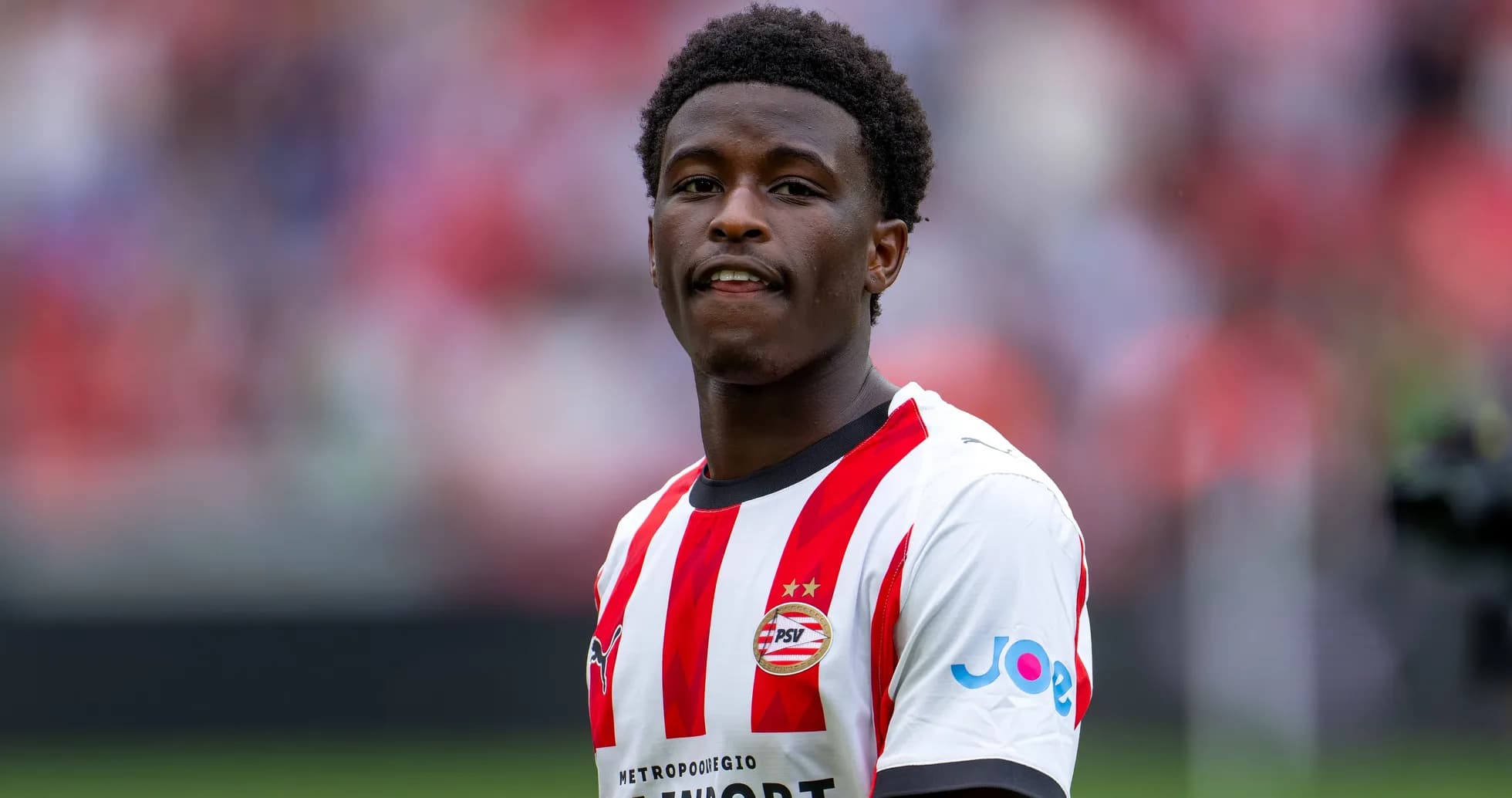 Player in PSV jersey during match warm-up