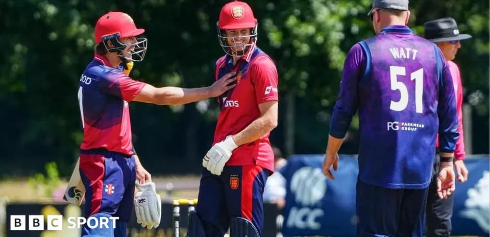 Players interacting during a cricket match on field