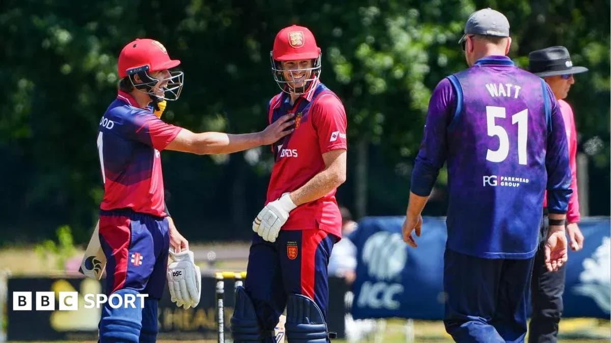 Players interacting during a cricket match on field