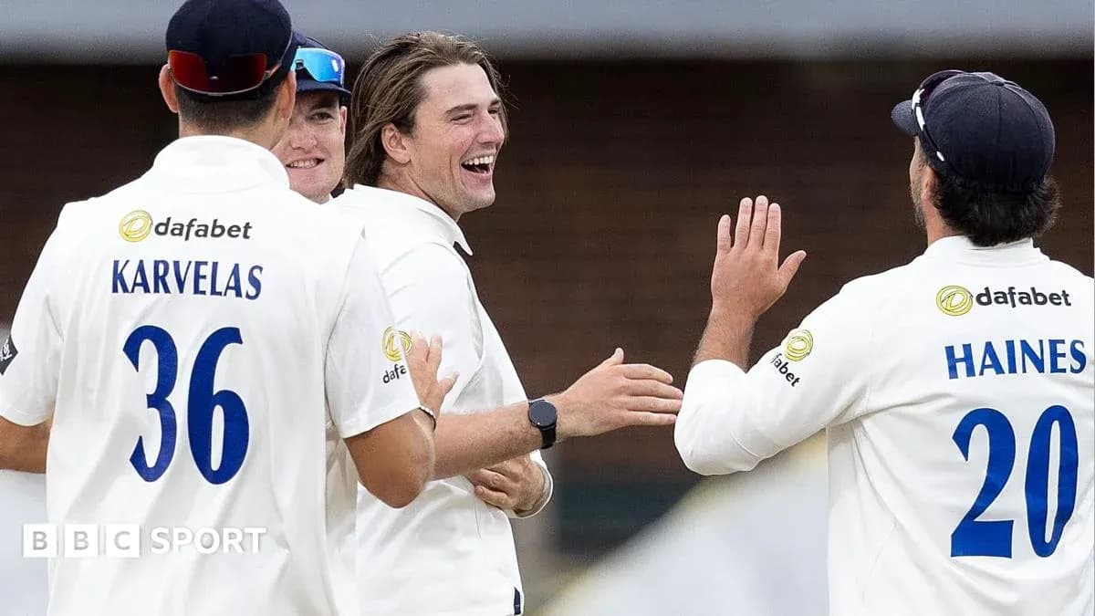 Cricket players celebrating a wicket on the field