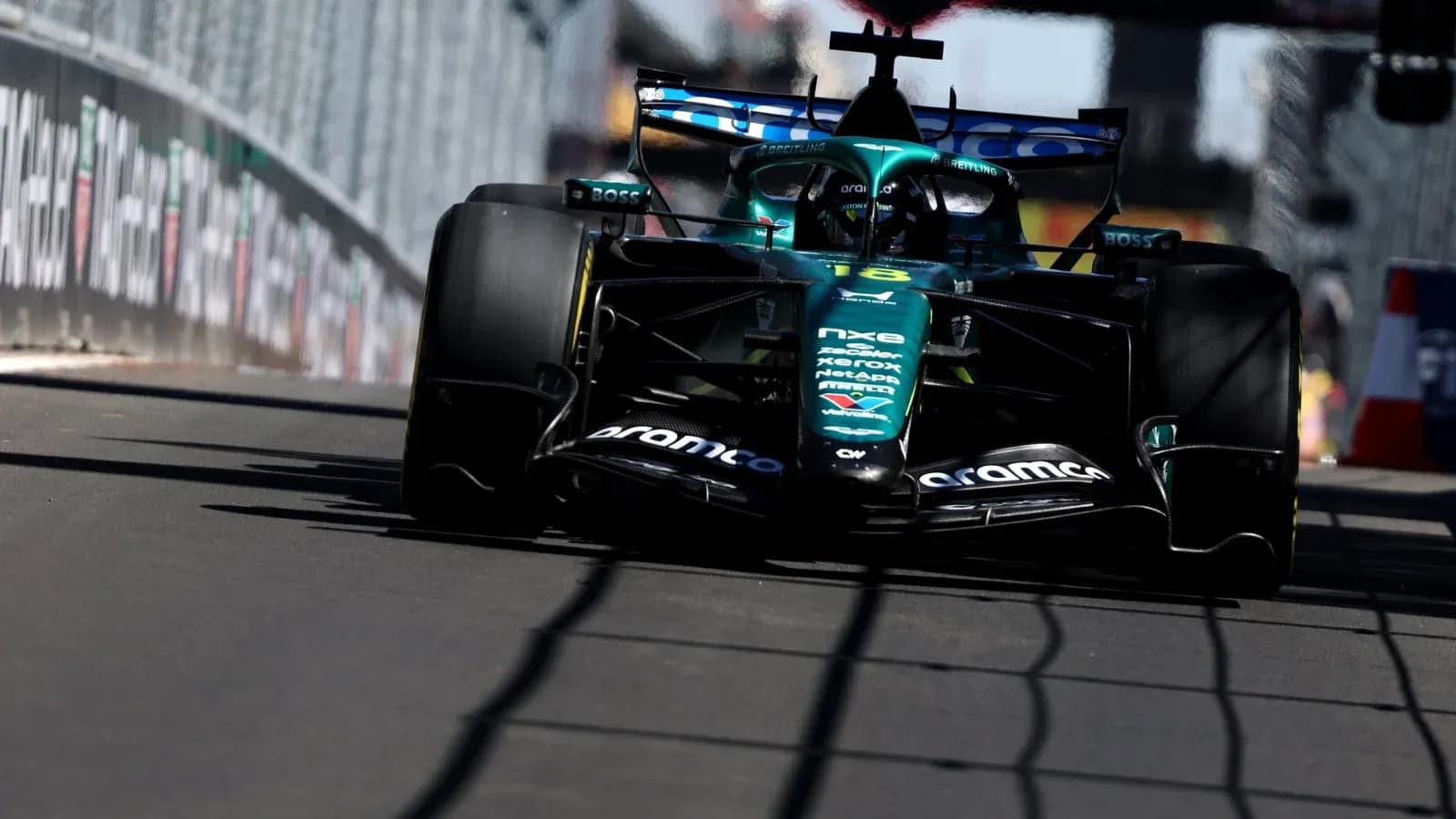 Aston Martin F1 car racing on track