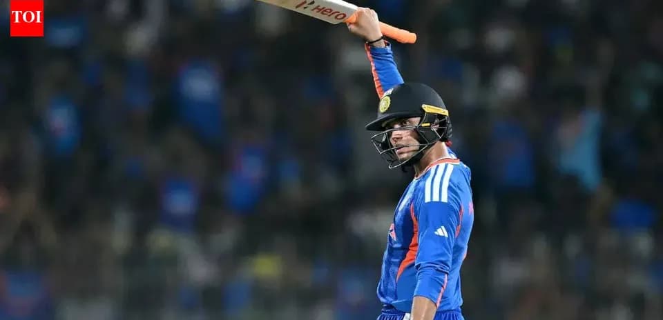 Batsman celebrating with raised bat during match