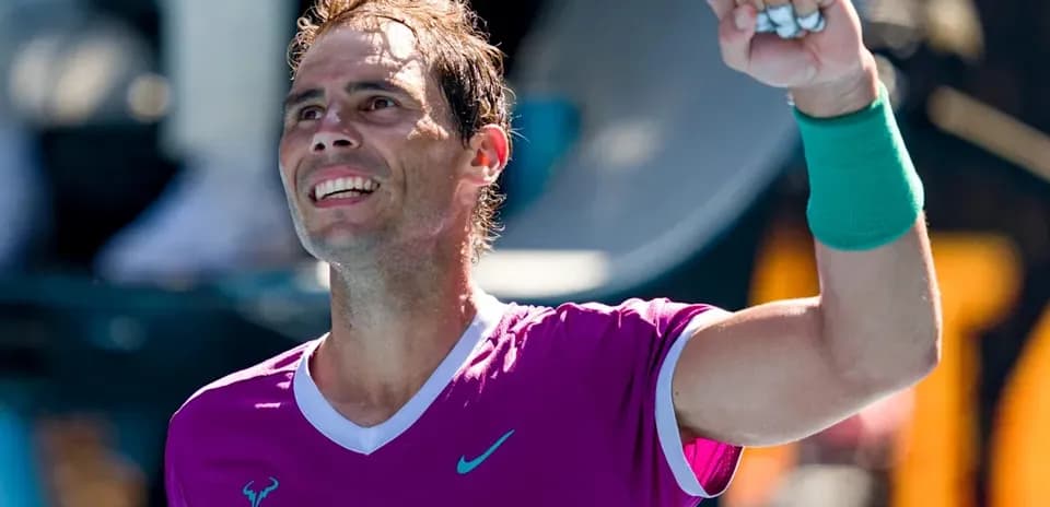 Tennis player celebrating victory with raised fist