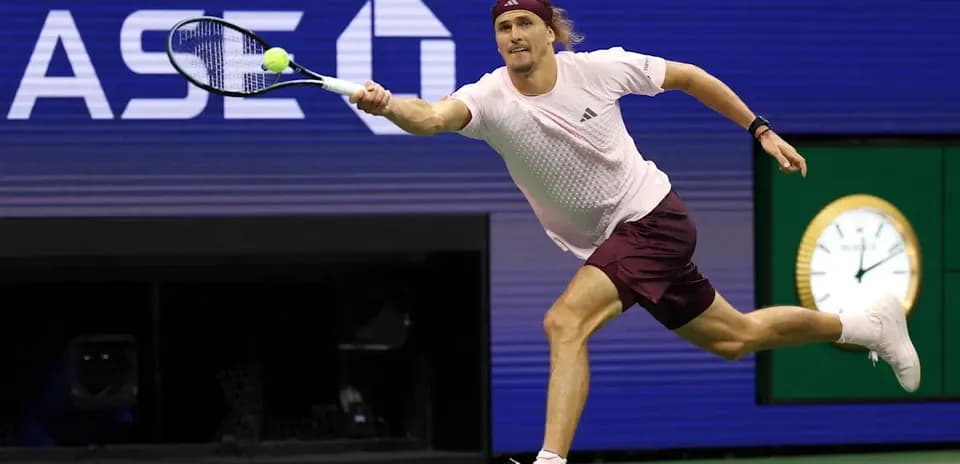 Player reaching for a tennis ball during match