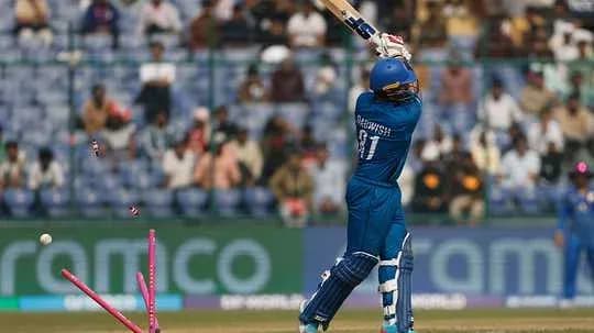 Batsman hitting the ball during cricket match