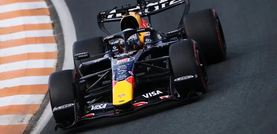 Formula 1 car navigating a racetrack corner