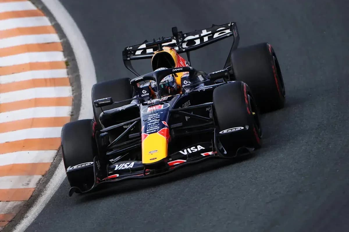 Formula 1 car navigating a racetrack corner