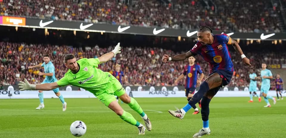 Player attempting to score while goalkeeper dives
