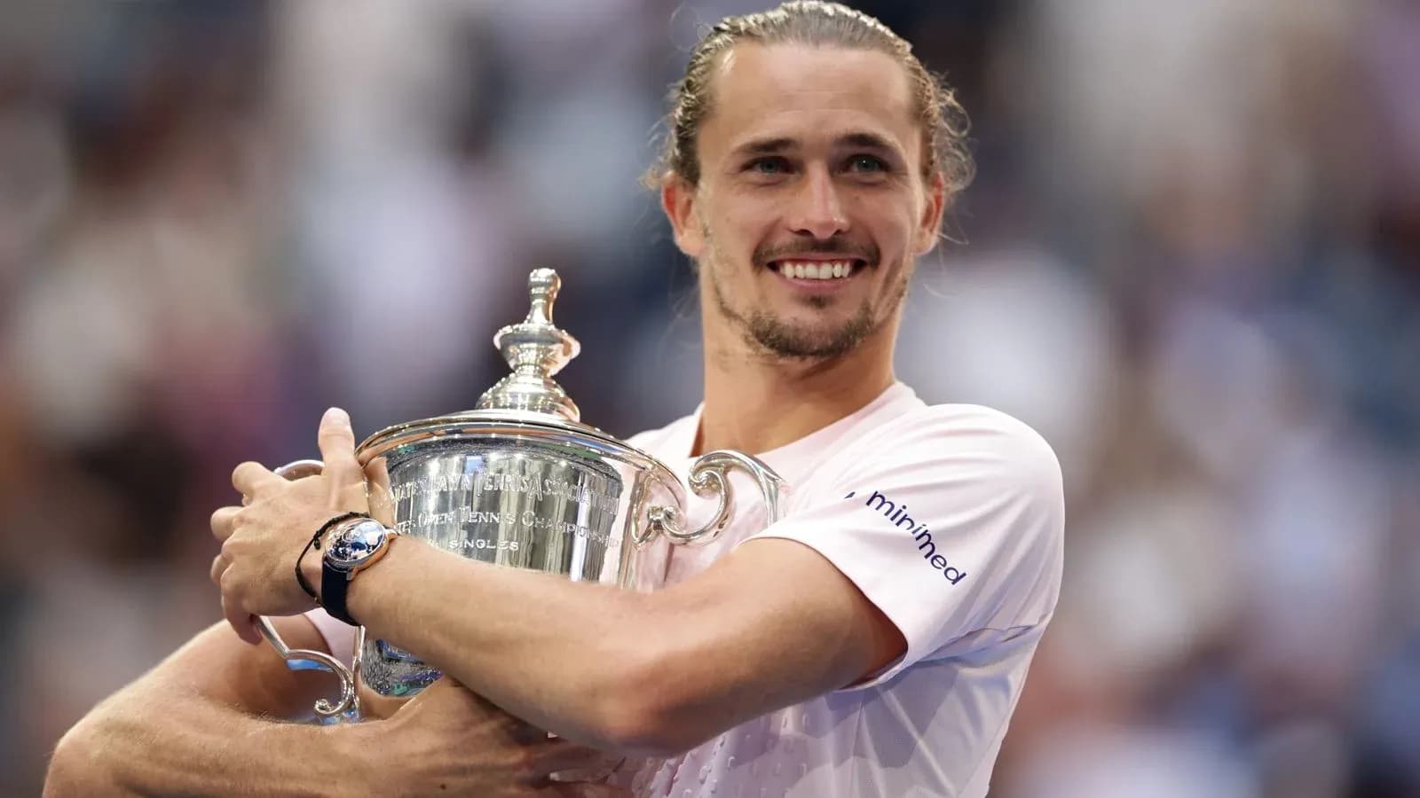 Player celebrating victory with championship trophy