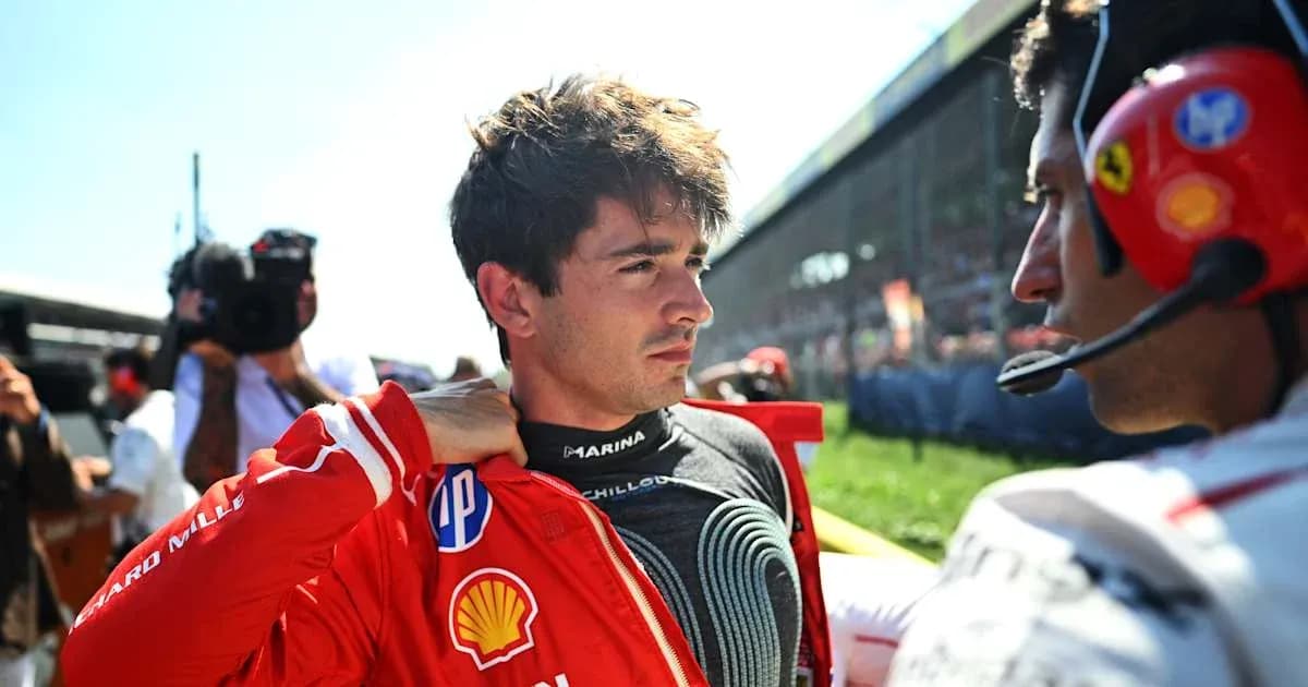 Driver preparing for race with team member assistance