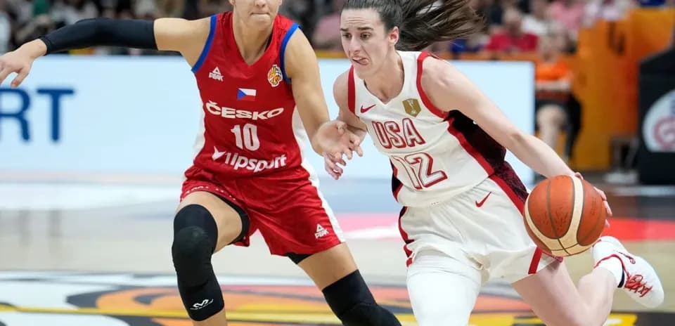 USA player dribbling past Czech player in basketball match