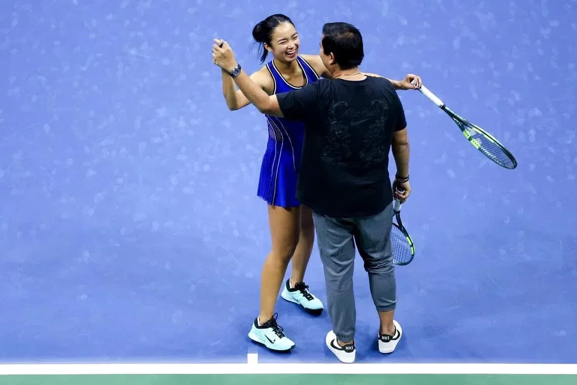 Player celebrating with coach after match victory
