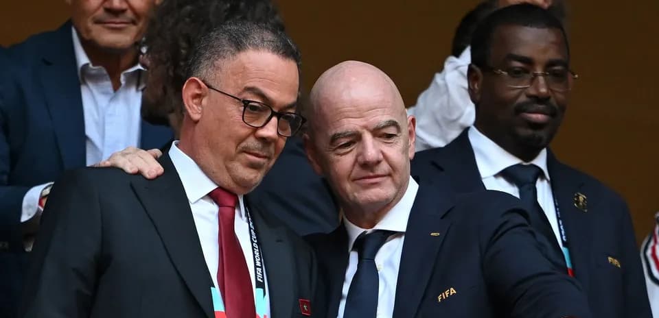Two officials discussing at a football event