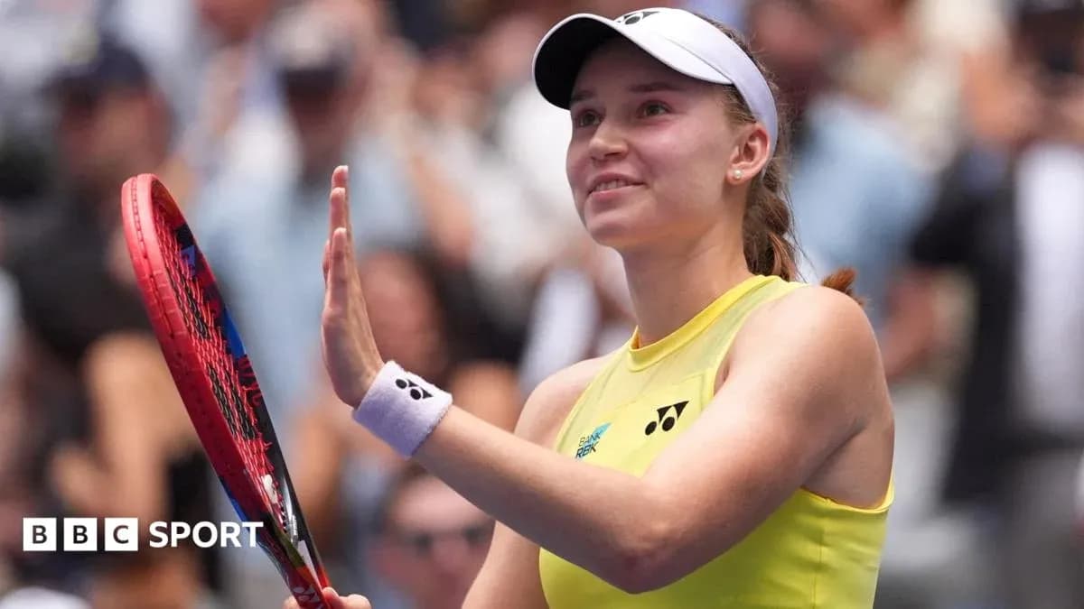 Tennis player waving with racket after match