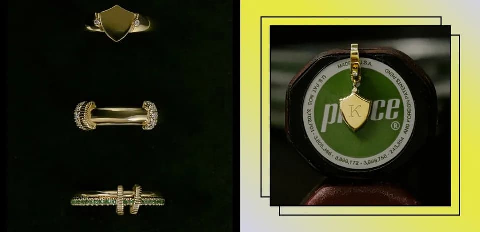 Gold rings and pendant displayed on a stand