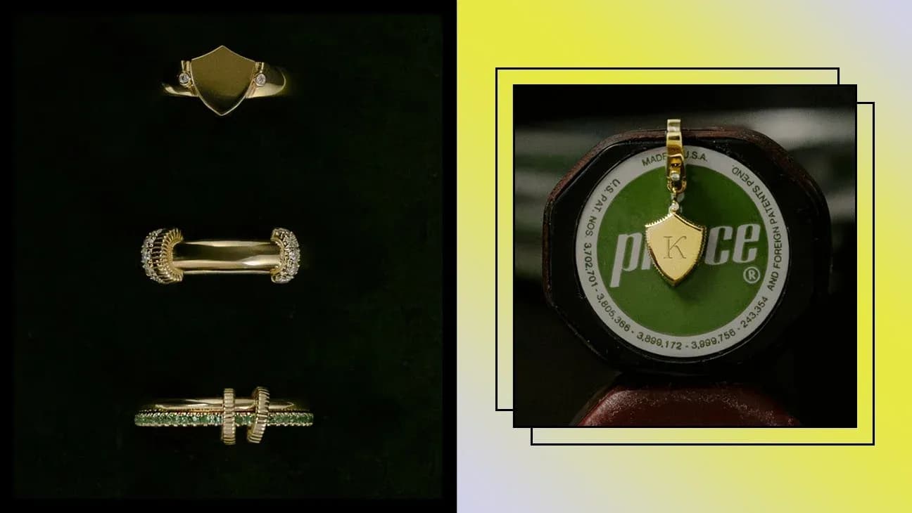 Gold rings and pendant displayed on a stand