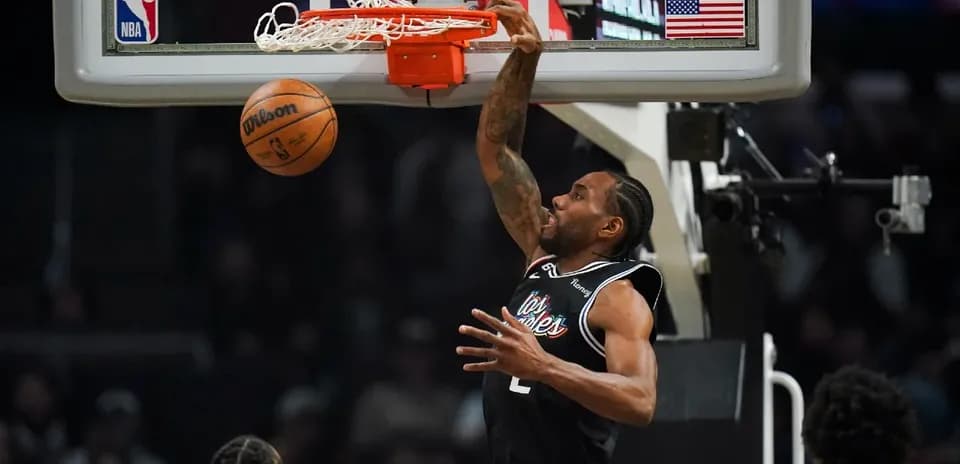 Player dunking a basketball into the hoop
