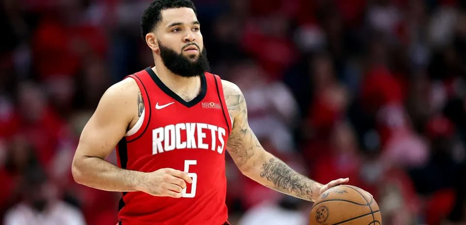 Player dribbling basketball in Houston Rockets jersey