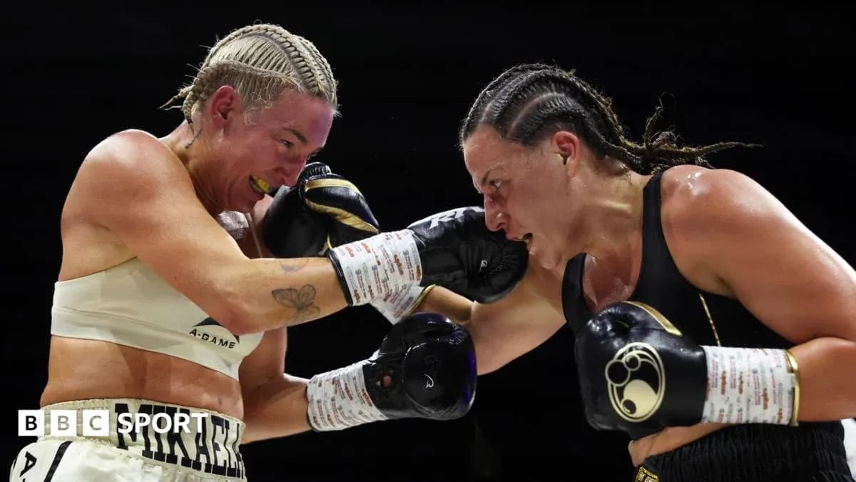 Two female boxers exchanging punches in the ring