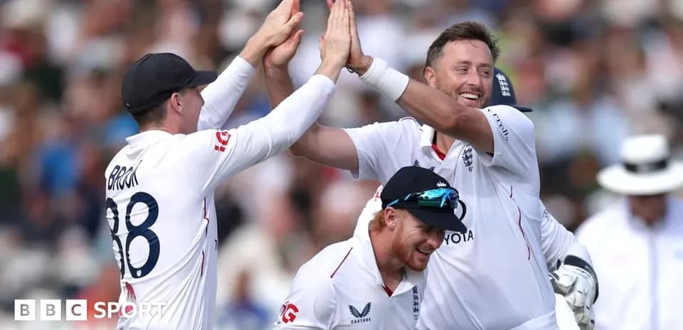 England players celebrating a wicket on the field