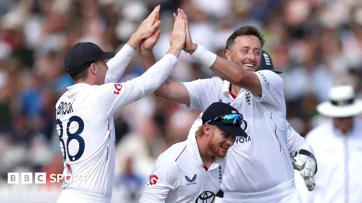 England players celebrating a wicket on the field
