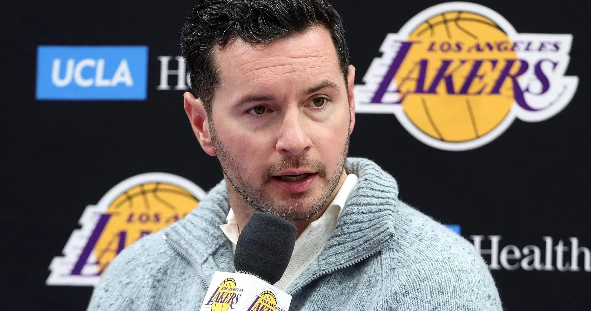 Man speaking at Los Angeles Lakers press conference