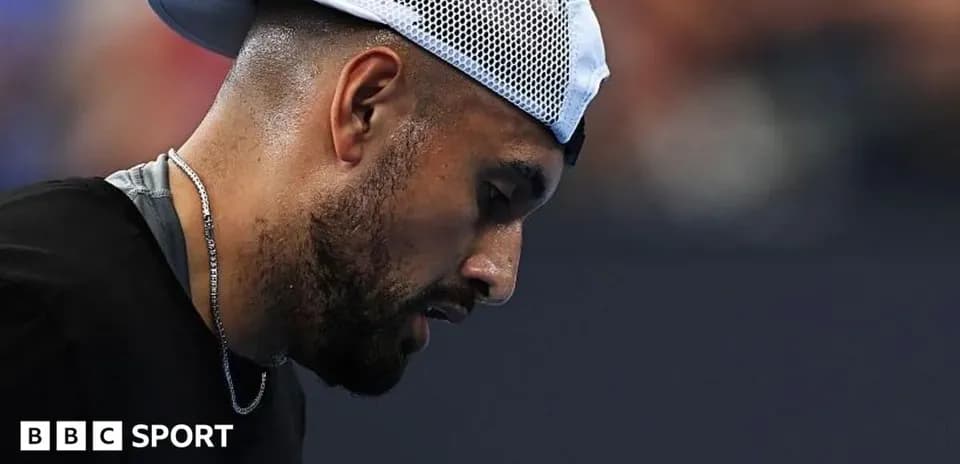 Tennis player looking down during match