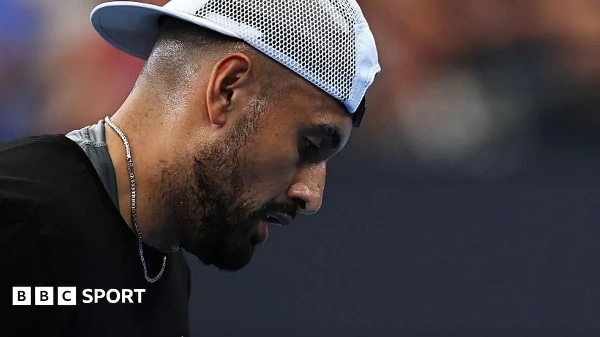 Tennis player looking down during match