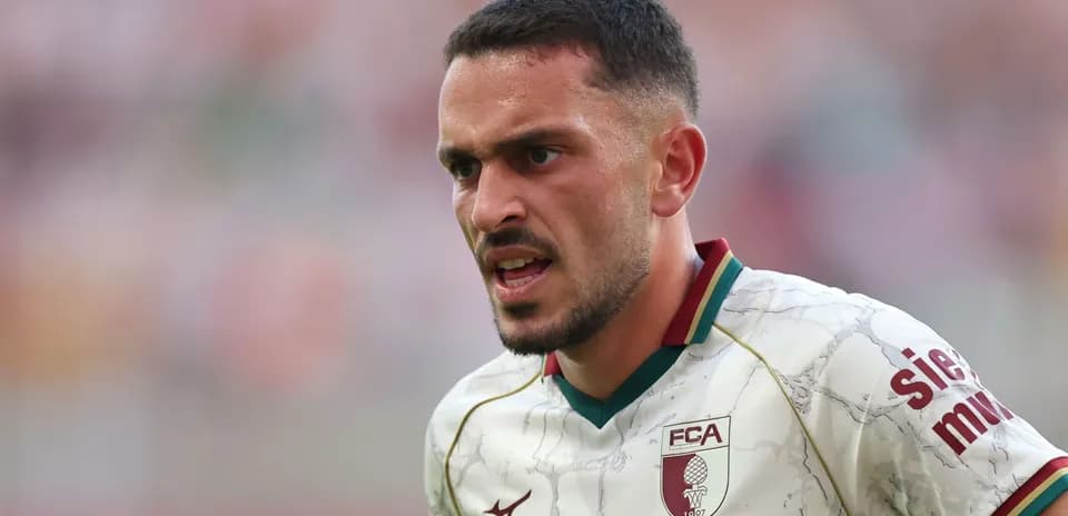 Player in action wearing FC Augsburg jersey