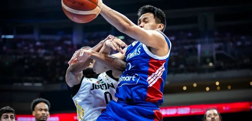 Player from Philippines attempting to shoot amidst defenders