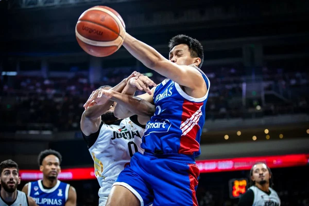 Player from Philippines attempting to shoot amidst defenders