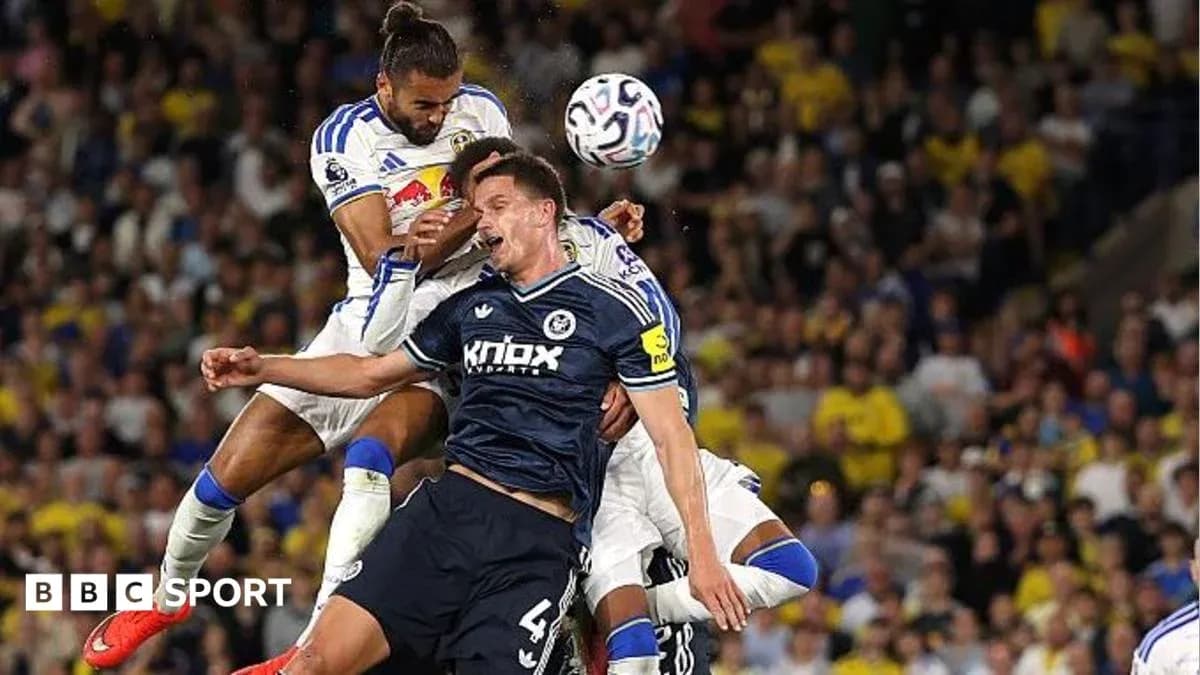 Players challenging for the ball during a match