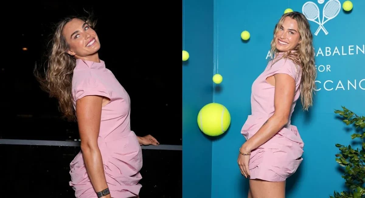 Woman in pink dress posing with tennis balls backdrop