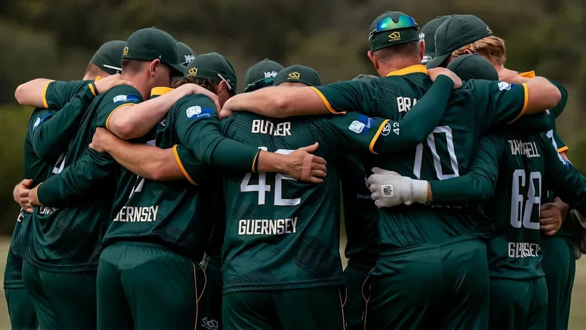 Cricket team huddling together in unity