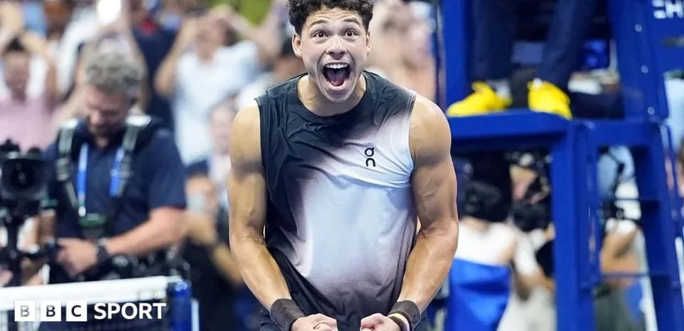 Tennis player celebrating a victory on court