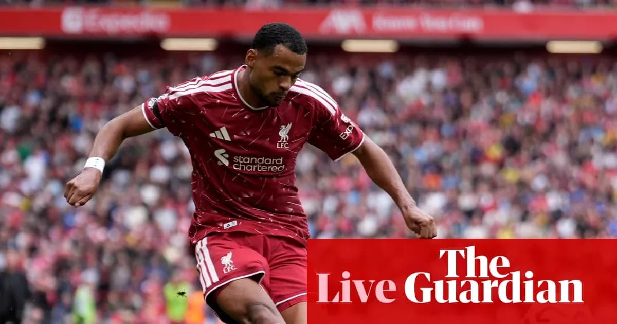 Liverpool player dribbling during a match at Anfield
