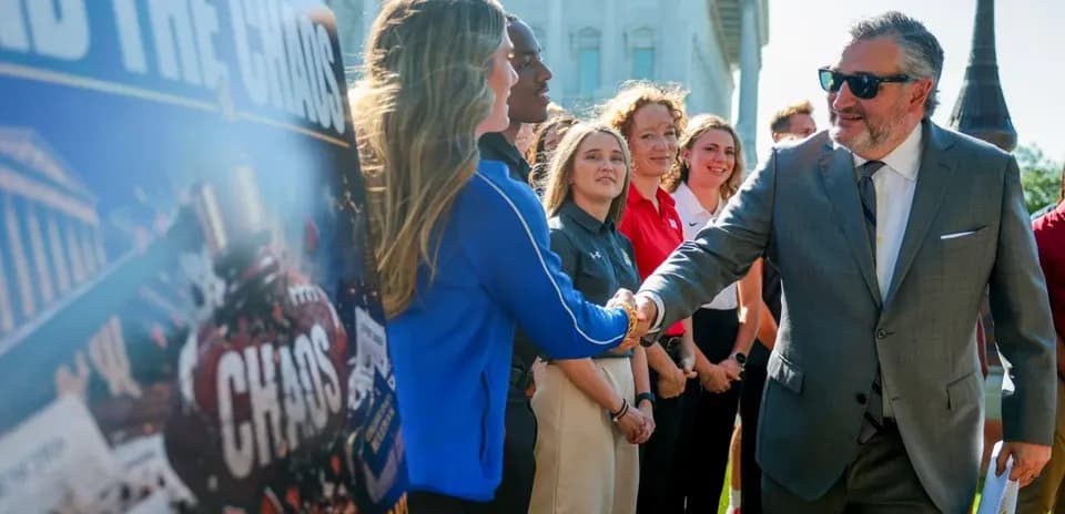 Man shaking hands with woman at press event